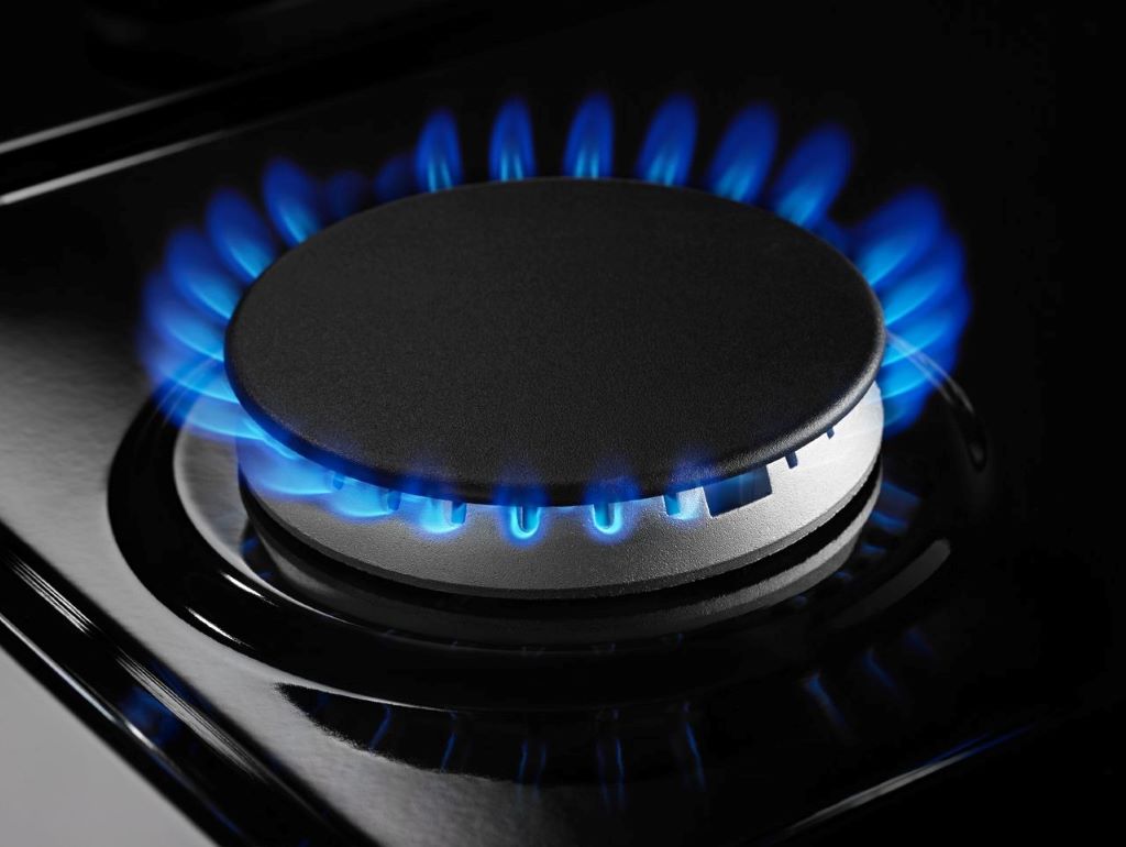 How do I increase the flame on my gas stove