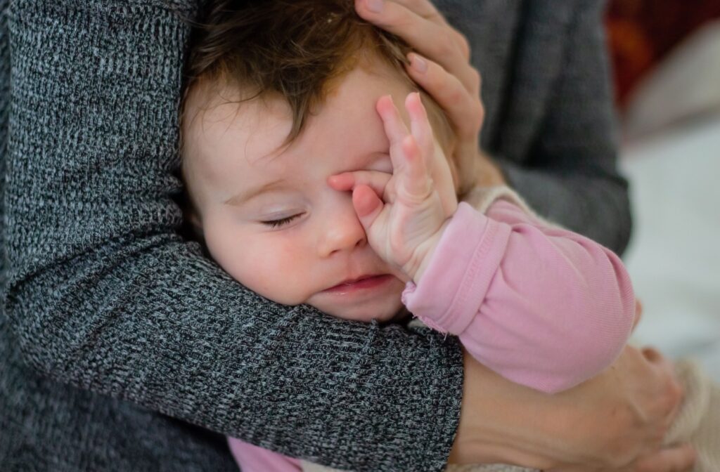 Why does my baby keep rubbing his eyes and red?