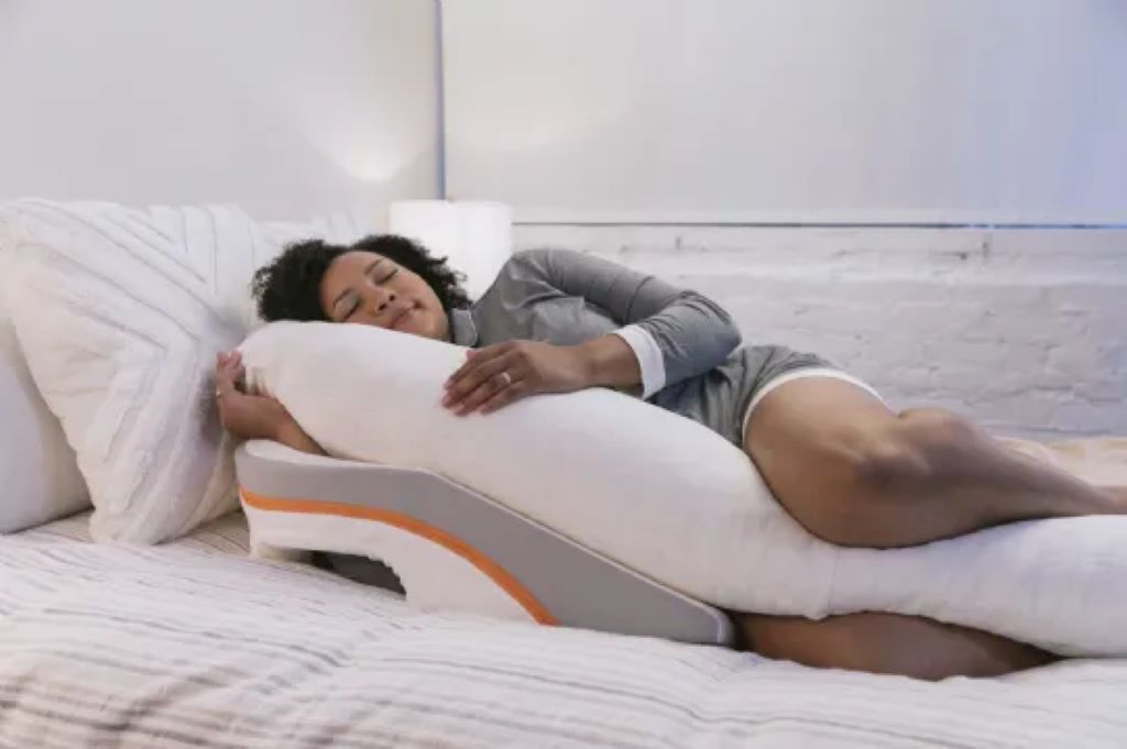 Side view of MedCline wedge system with arm pocket supporting side sleeping against heartburn.