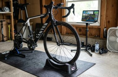 A front wheel riser block supporting a road bike on an indoor trainer for better balance