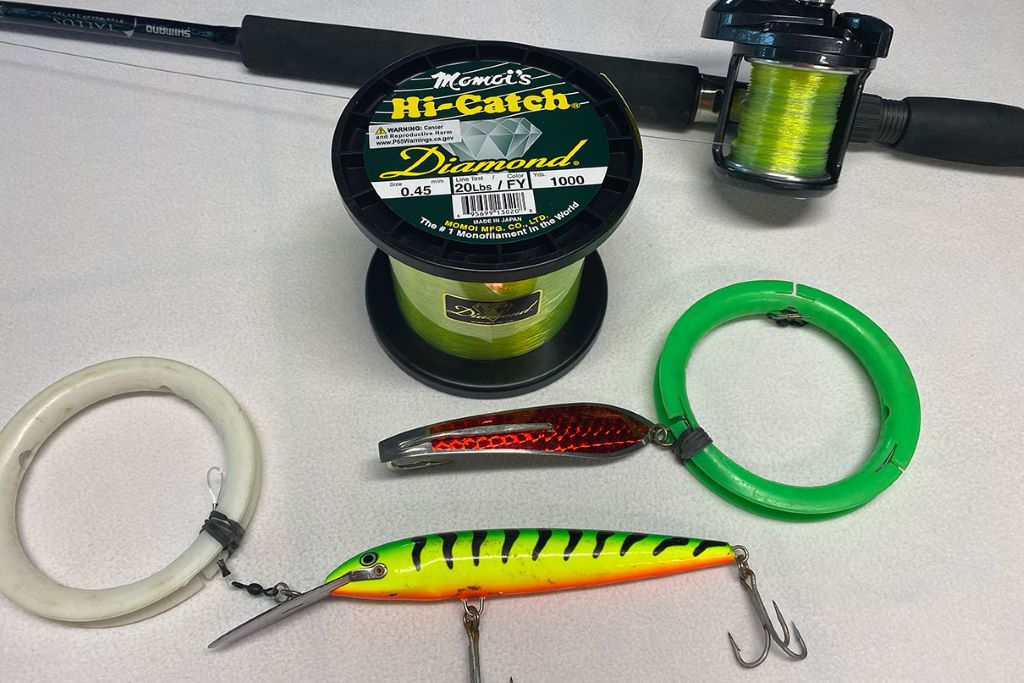 Close-up of fishing line being spooled onto a beginner fishing reel