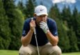 Golfer lining up a putt on a scenic Washington state golf course.
